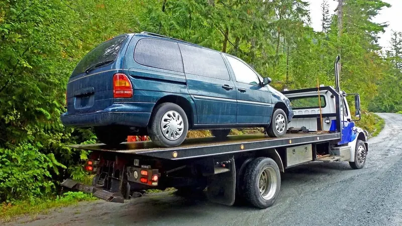 Chicago flatbed towing a cargo van