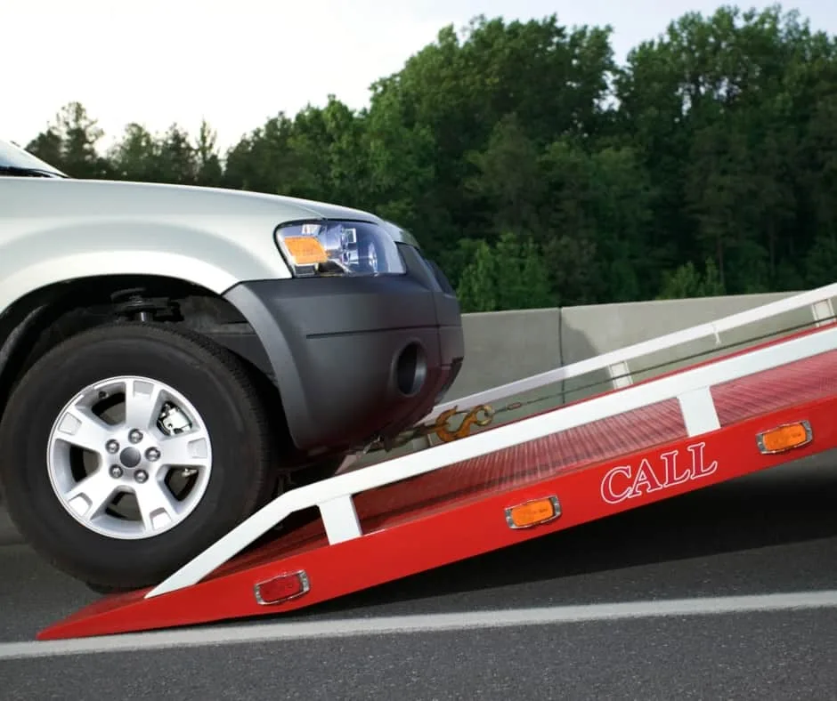 Chicago tow truck loading a vehicle on a residential street