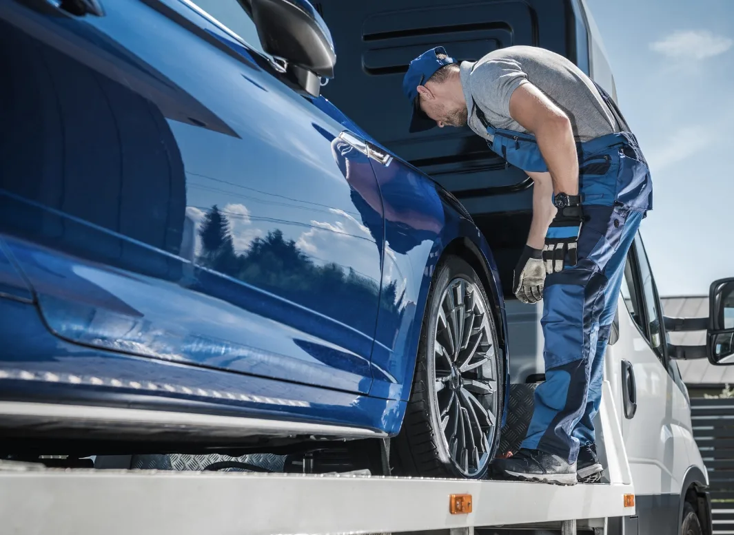 Cicero tow truck operator loading vehicle